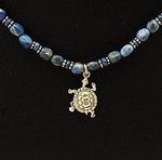 Lapis lazuli bead necklace with sterling silver turtle close up