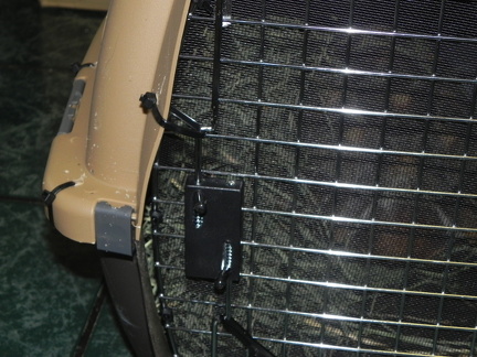 Crate door latch secured